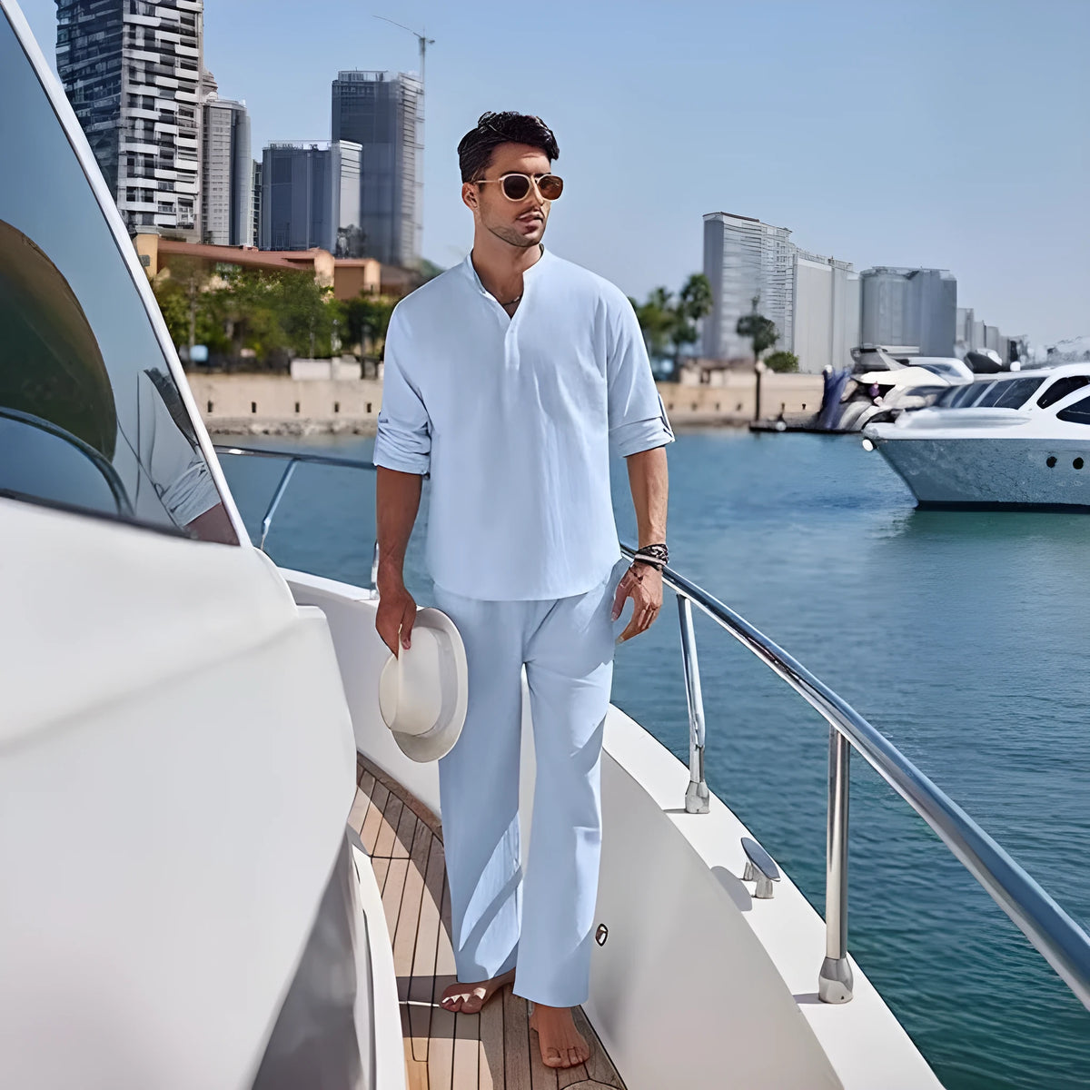 Man wearing a solid colour cotton long sleeve top and matching trousers from a casual suit.