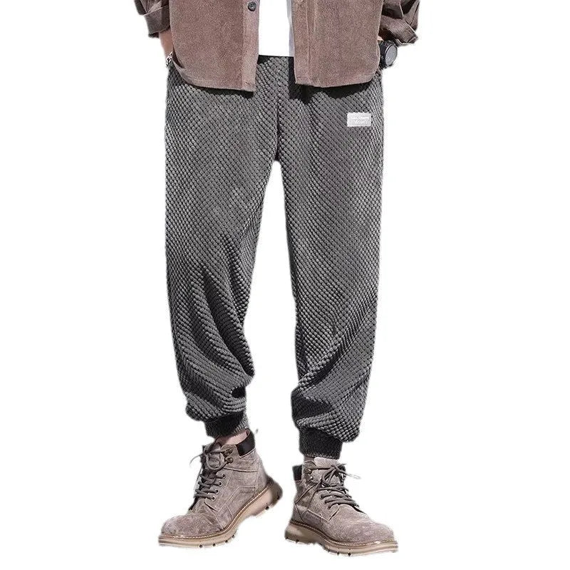 Men's grey casual sweatpants with an ankle tie and straight-leg fit.