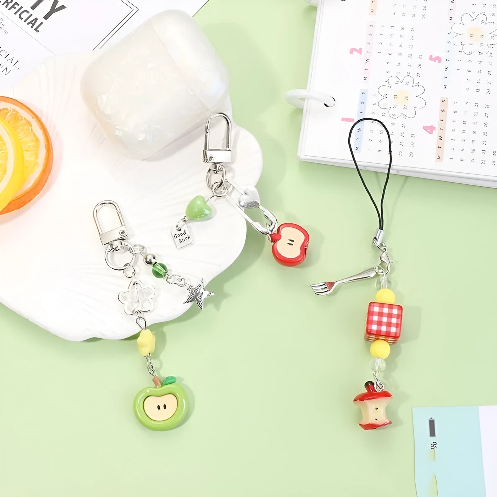 Fruit pattern mobile phone charm keychain with apple and strawberry designs in plastic resin material