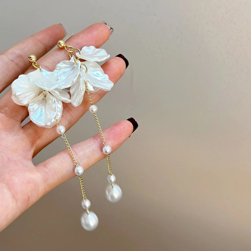 Women's acrylic shell pearl tassel earrings showing 8.8cm length with multiple clip style options