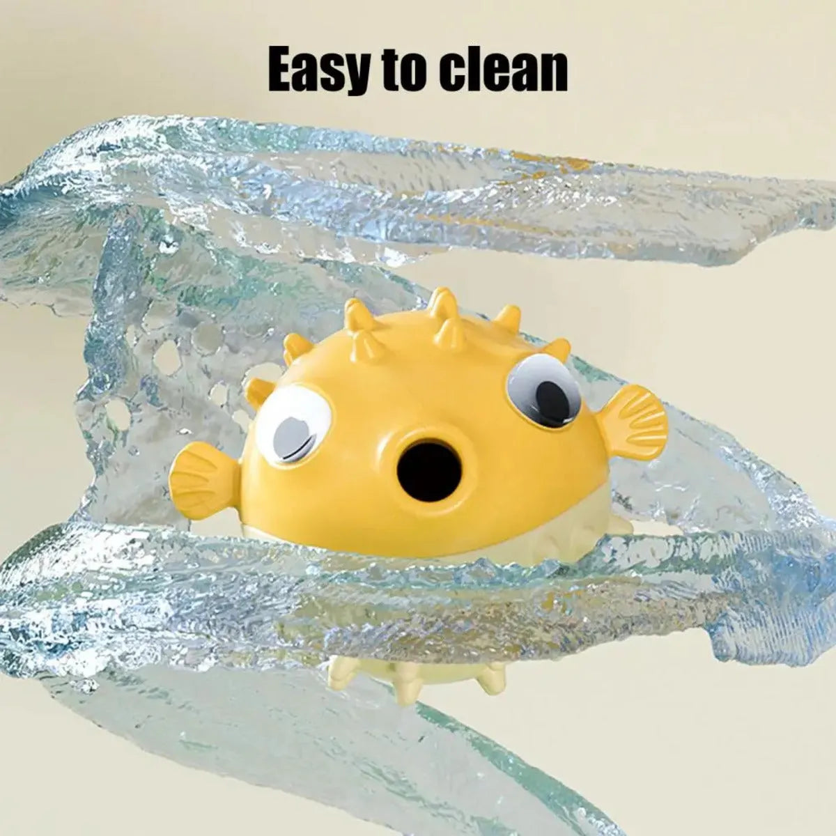 Yellow fish-shaped vinyl dog chew toy with textured surface and squeaker