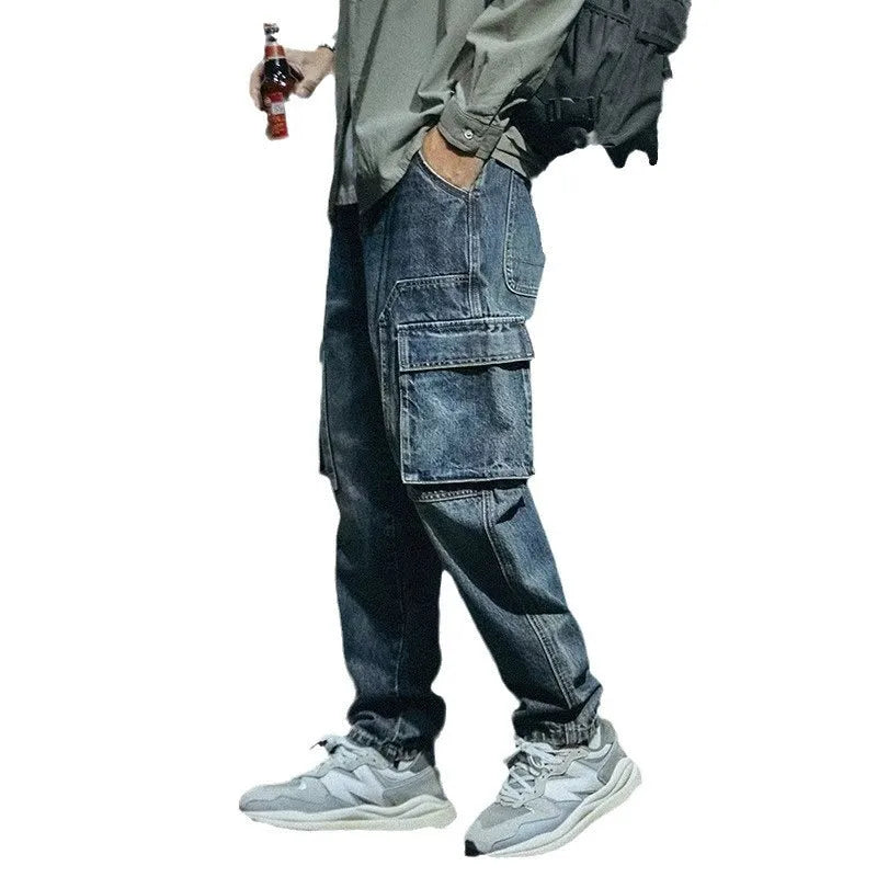 Blue men's loose straight-leg retro jeans with a zip fly, laid flat.