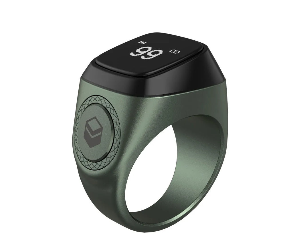 Silver smart ring with a small OLED display showing prayer count, next to its USB charging case.