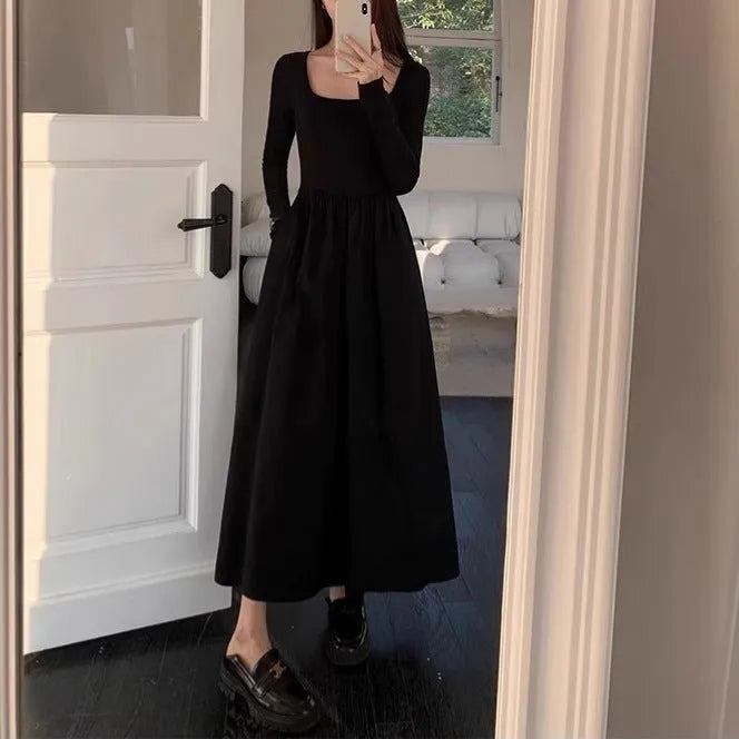 Women's black square collar knitted dress with long sleeves and an A-line skirt.