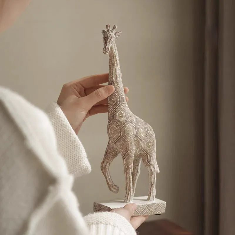 Wood colour synthetic resin giraffe ornament in European style on a shelf.