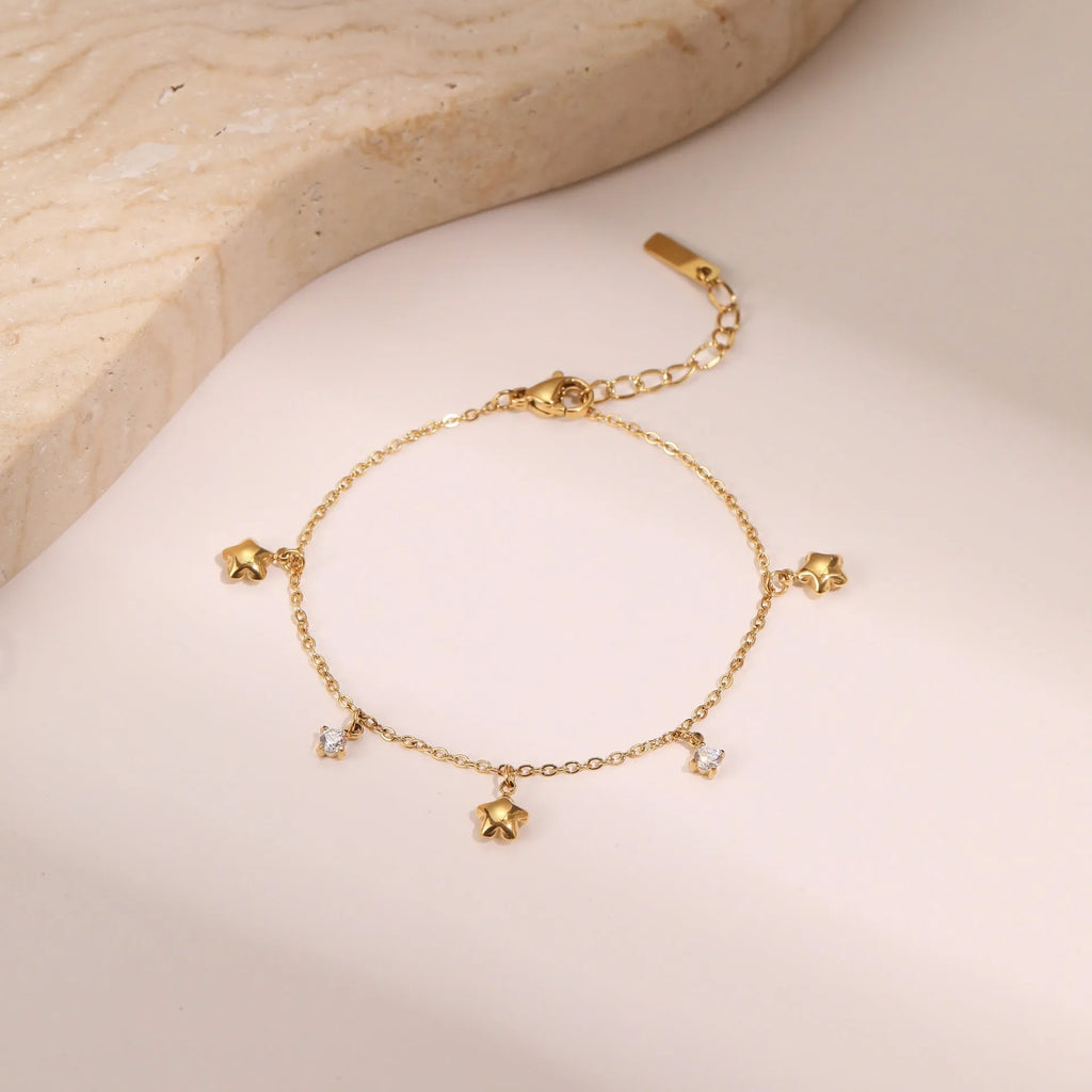 Gold or steel coloured women's bracelet with a hexagonal star zircon pendant on a stainless steel chain.
