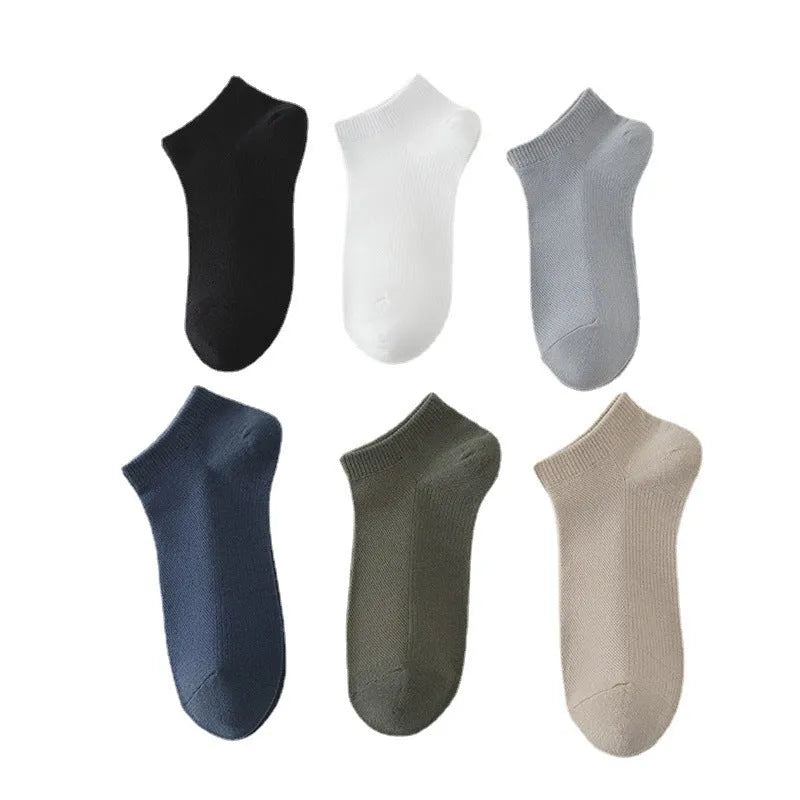 Men's solid colour polyester boat socks showing low-cut ankle design in various colour options