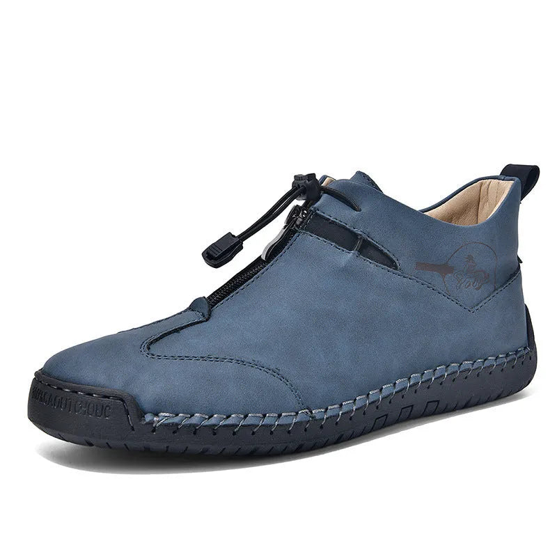 Men's black casual leather shoes with a mid-heel and rounded toe on a neutral background