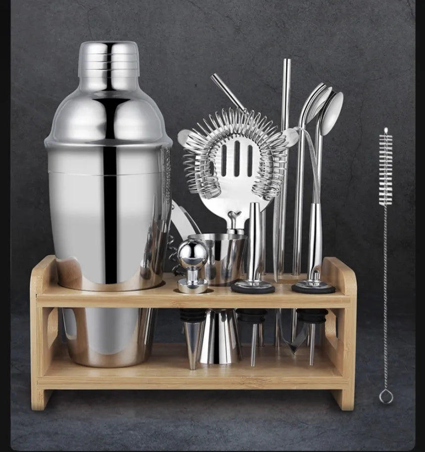 23-piece stainless steel cocktail set with acrylic European-style mixers arranged on bar surface