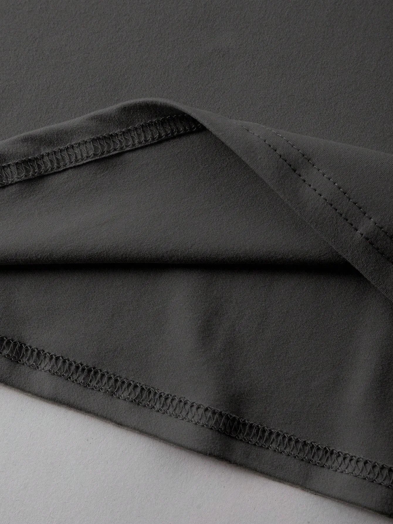 Loose-fit cotton summer T-shirt on a hanger, showing short sleeves and round neck in grey