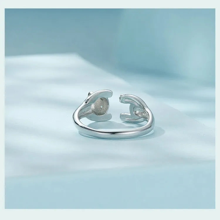 Adjustable sterling silver panda ring with white gold plating and open bracelet design.