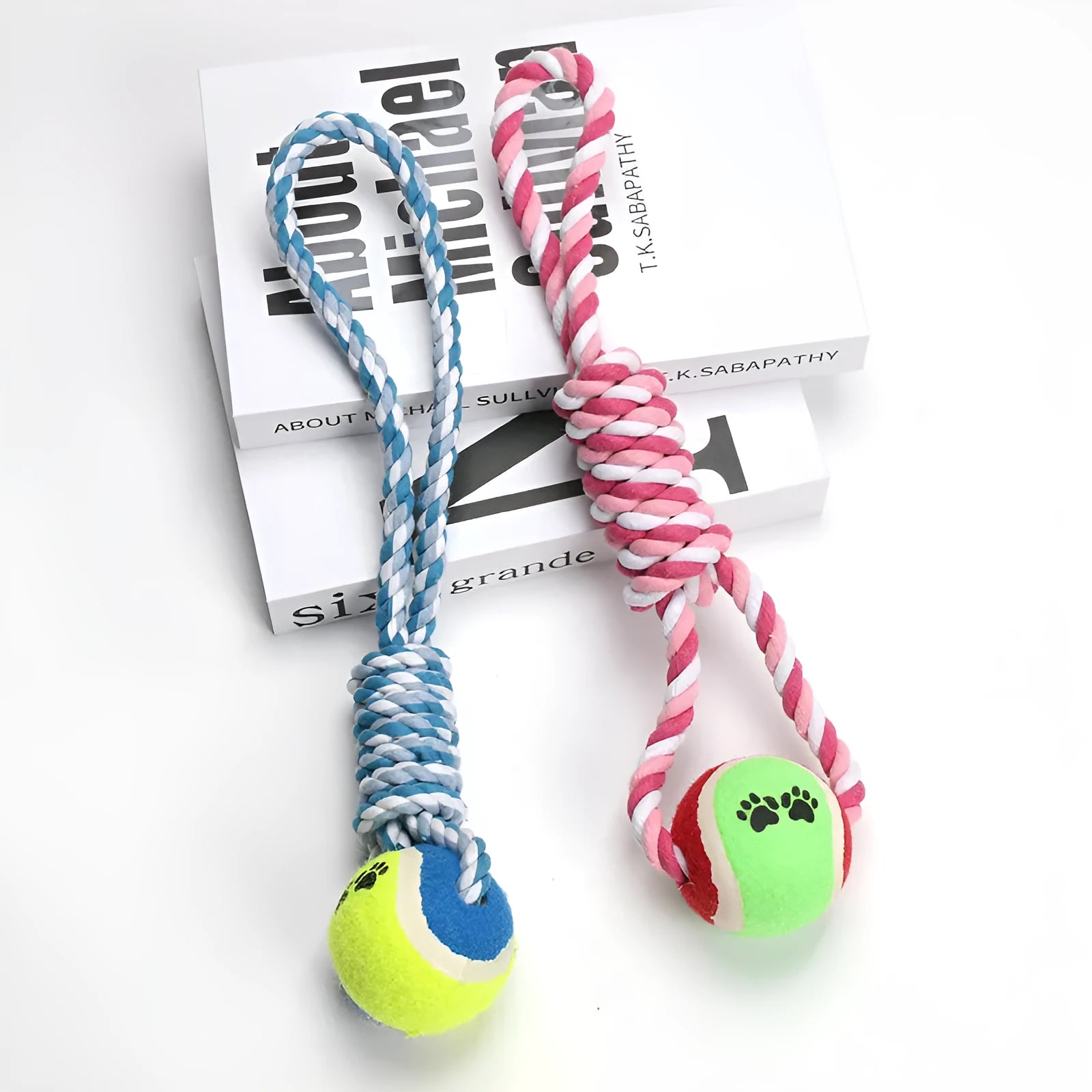 A long, braided red and white cotton rope dog toy for medium and large breeds.