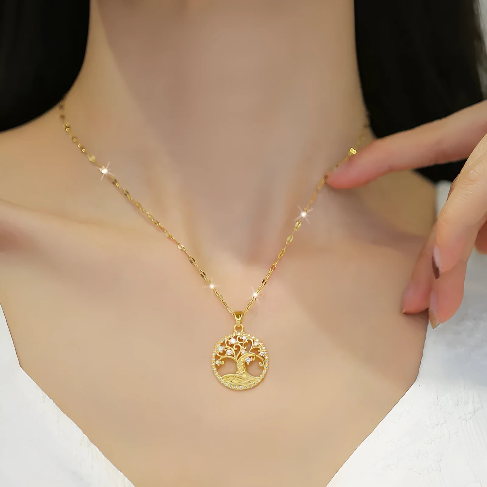 Gold-plated cross necklace with rhinestone lucky tree pendant and mother pearl detail on adjustable 41-50cm chain