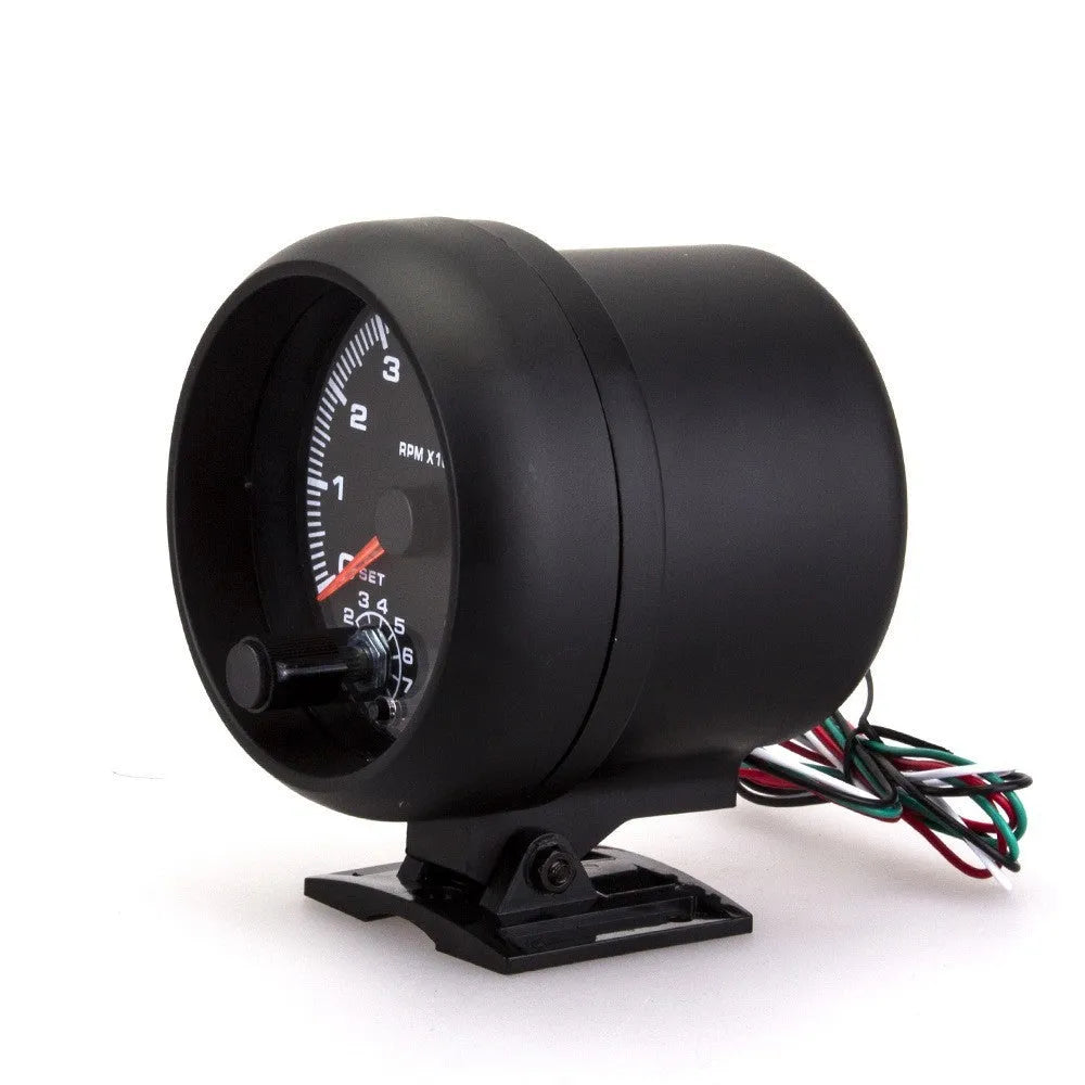 Black automotive tachometer with blue-lit dial showing RPM scale up to 8000