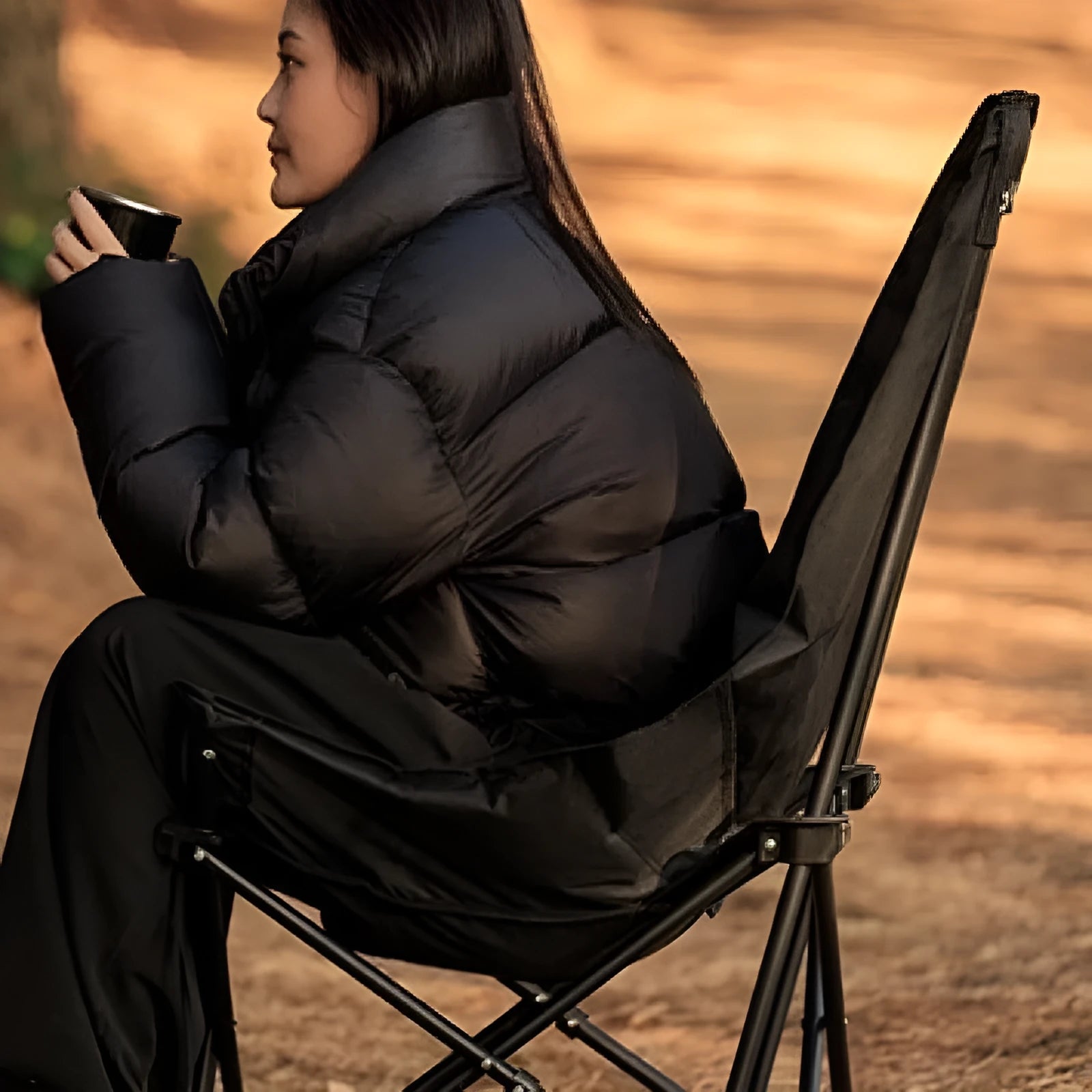 Night Black Oxford cloth camping recliner folding moon chair in outdoor setting