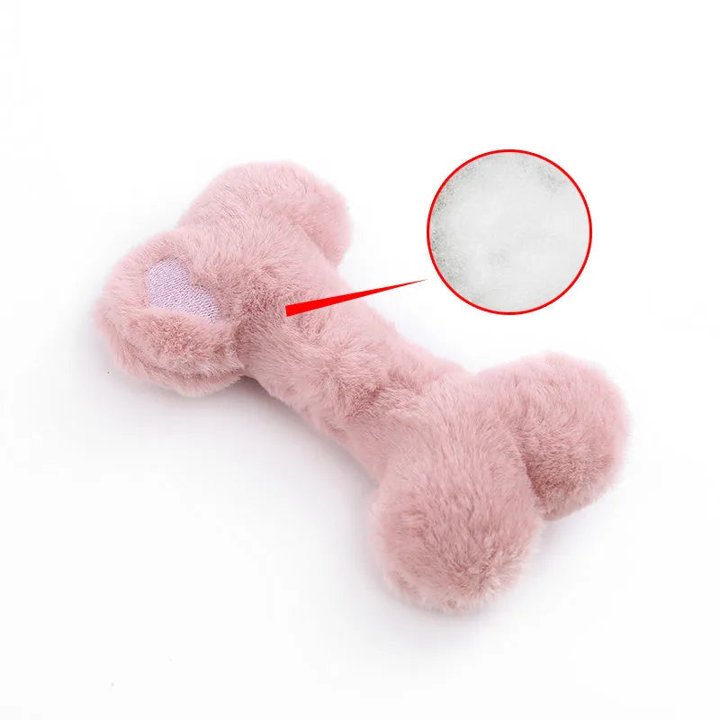 Blue plush bone-shaped dog toy with a squeaker, labelled Grinding Teeth, on a plain background