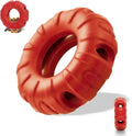 Blue natural rubber tyre-shaped dog chew toy with oval openings for treat dispensing.