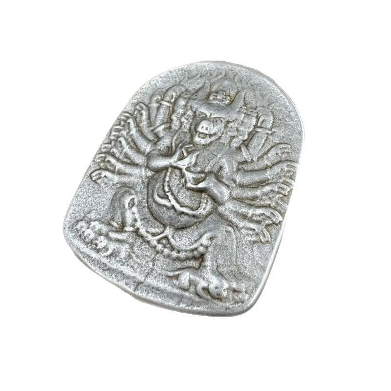 Close-up of iron Chinese style geometric pendant ornament featuring Aryaacalanatha Yamantaka motif.