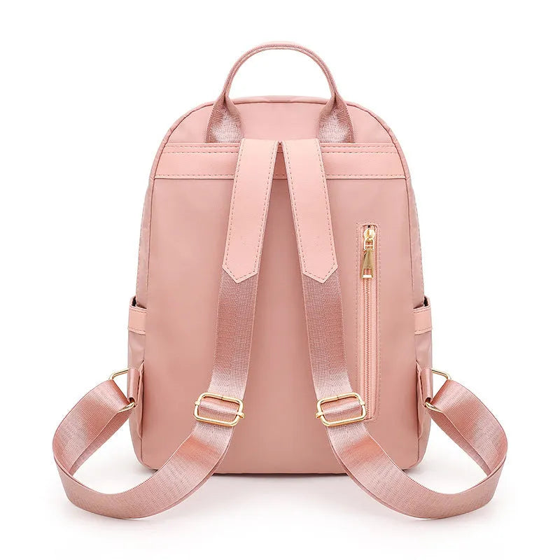 Women's black casual nylon backpack with multiple pockets and soft shoulder straps