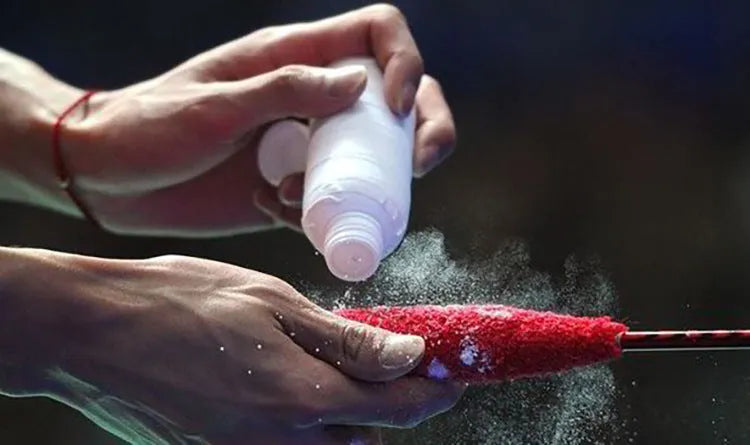 White magnesium carbonate sports anti-slip powder in a container for badminton and gym use.