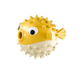Fish-shaped interactive dog toy with treat dispensing in green, red, or yellow colours