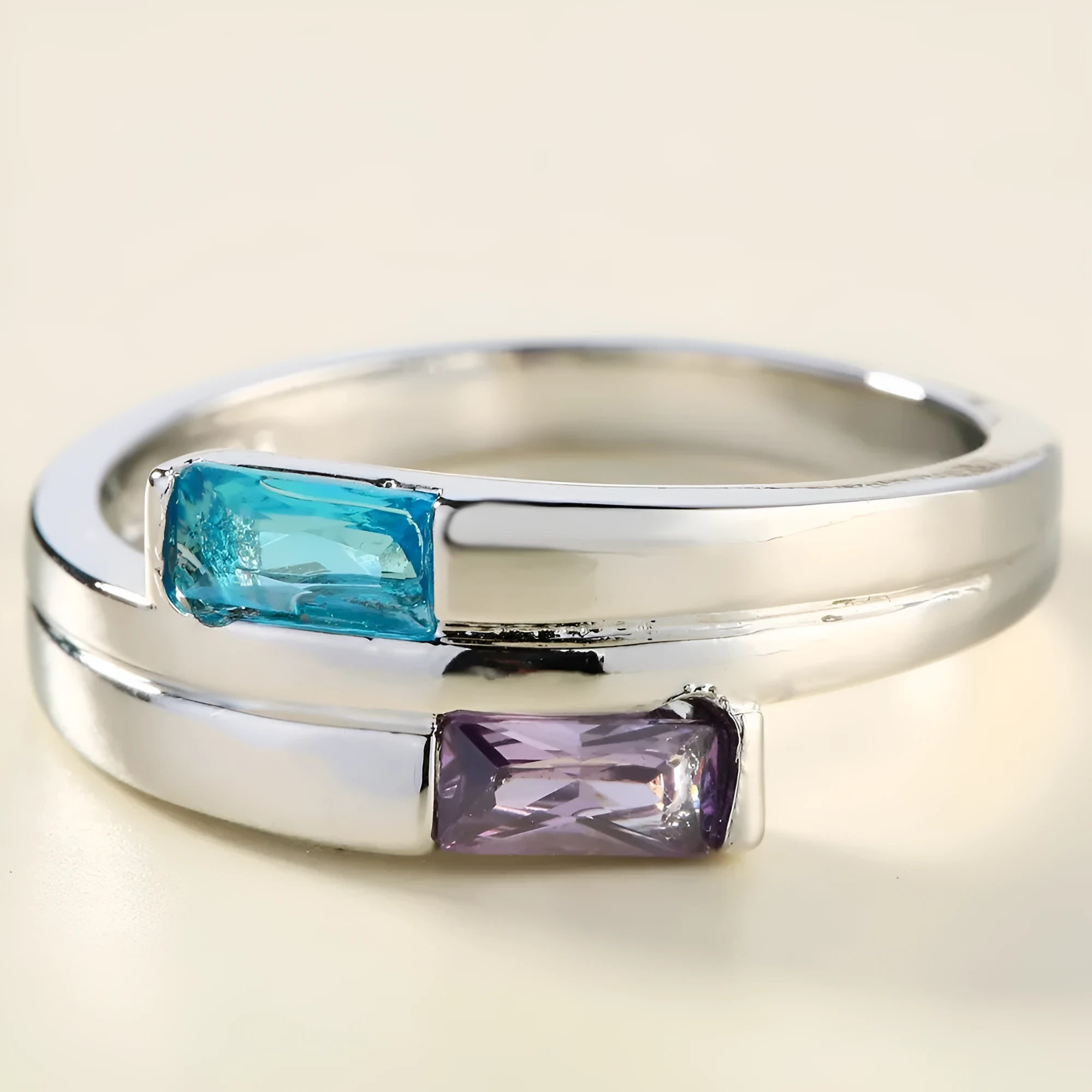 Silver-coloured copper ring with decorative zircon stone inlays on finger