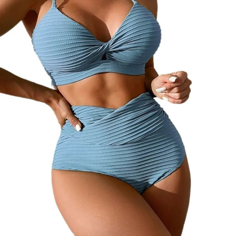 Women's solid colour two-piece bikini on a white background.