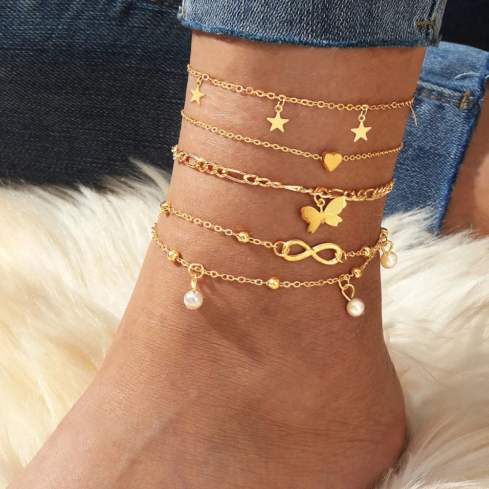 Four-piece butterfly pearl heart anklet set with layered alloy foot chains