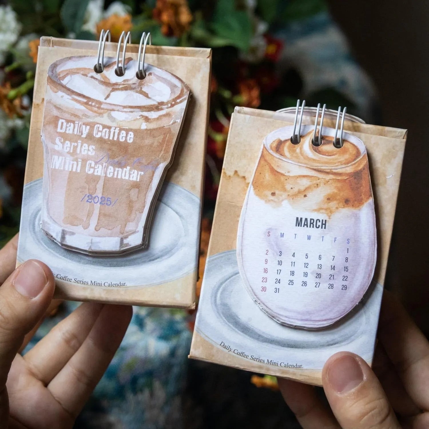 Mini coffee-themed desk calendar showing 2025 dates with motivational text
