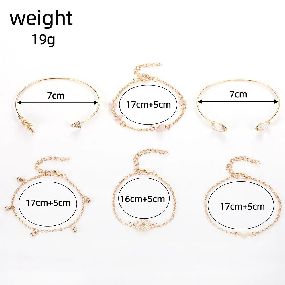 Gold zinc alloy bracelet set with six charms including spot drill, arrow, and water drop shapes.