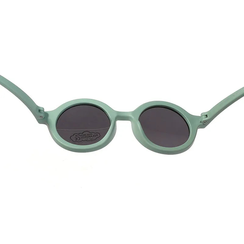Soft silicone round-frame sunglasses for babies and toddlers aged 0-3 years with polarised UV400 lenses.