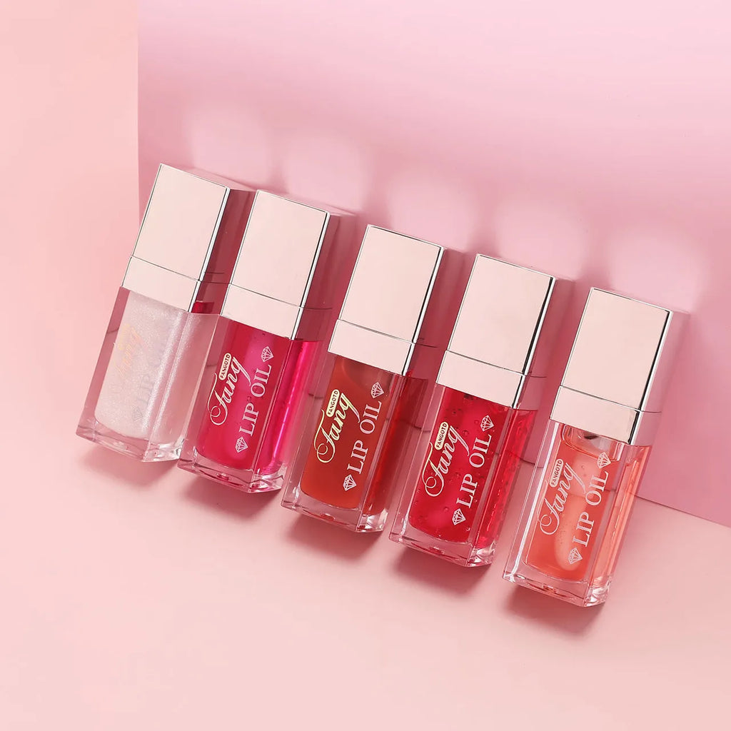 Five colour options of bright lip gloss mint lipstick with lip essence oil applicator