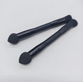 Elegant black double-headed concealer brush with miter sponge and synthetic bristles on a wooden handle.