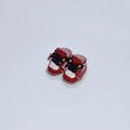 A pair of 17cm high PU replacement shoes for dolls in a selected style and colour.