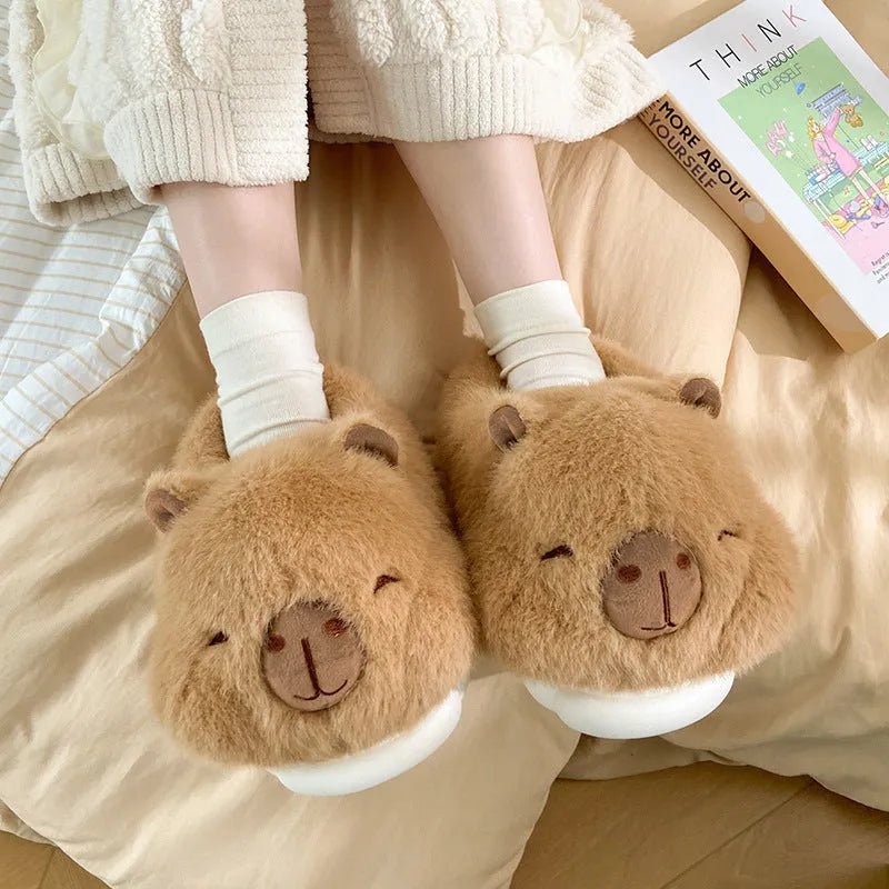 Light brown women's winter slipper boots with a cartoon pattern, cotton canvas upper, and artificial wool lining.