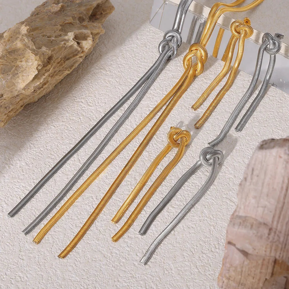 Gold titanium steel necklace with knotted tassel pendant and matching earrings set