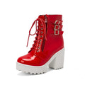 Women's black chunky heel ankle boots with front lace-up and round toe on a waterproof rubber sole.