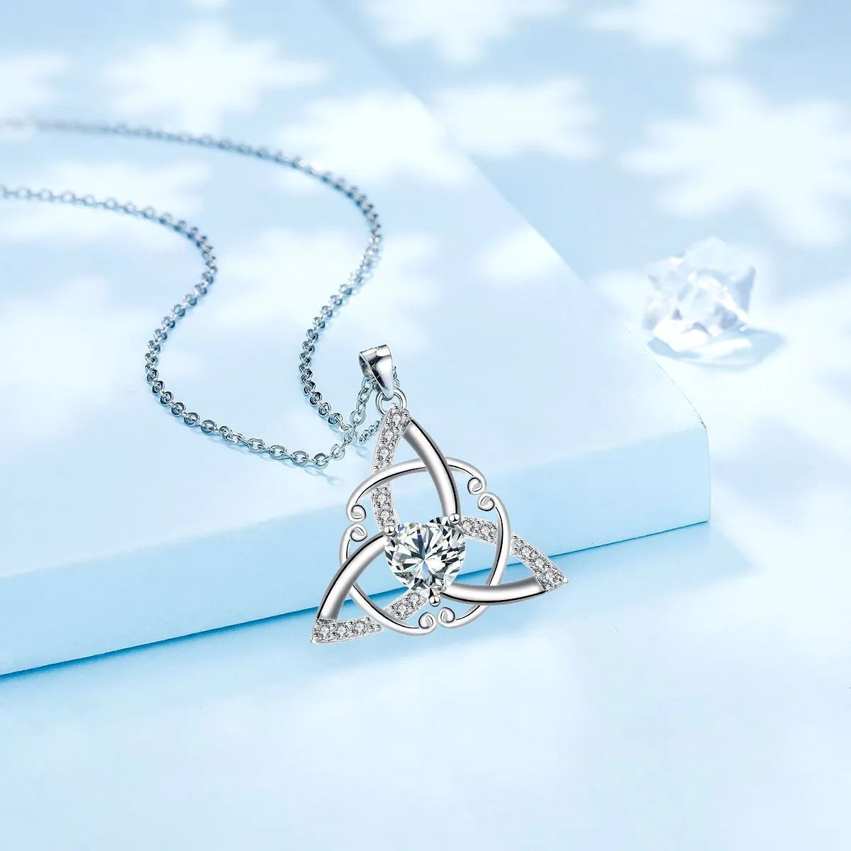 Sterling silver plated Celtic knot necklace for women with geometric pendant, available in four crystal colours.
