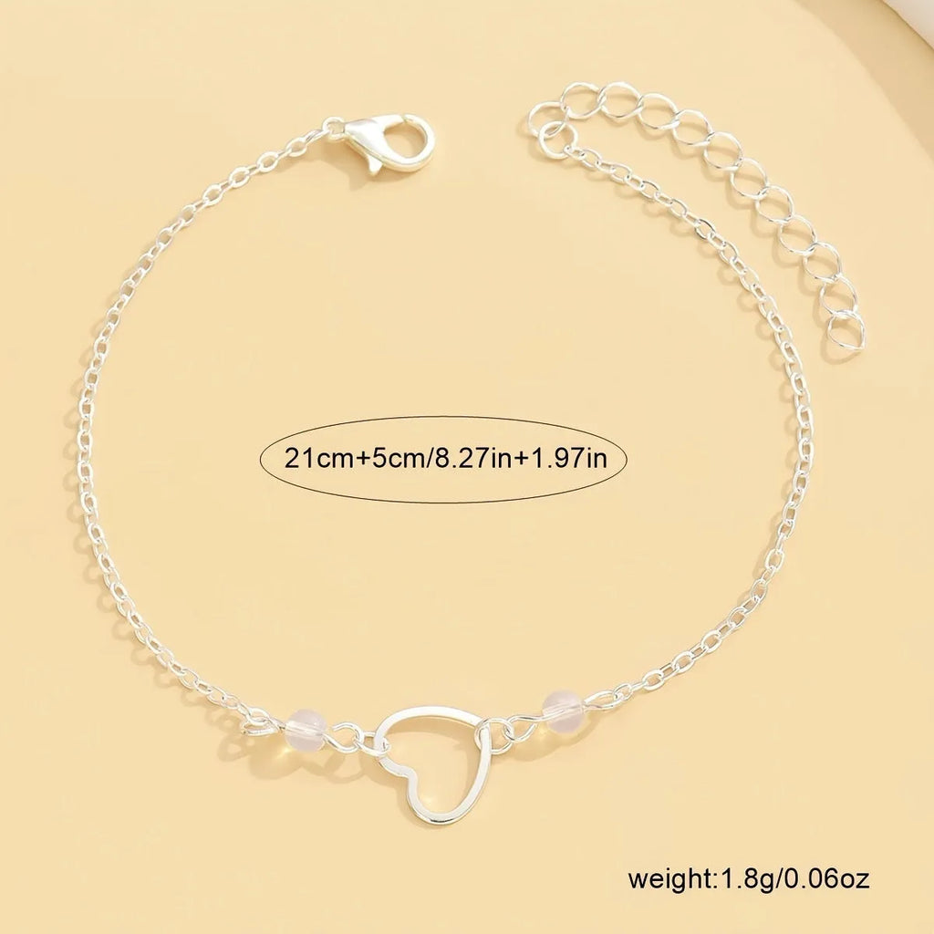 Gold and silver adjustable anklet with heart pendant and geometric chain