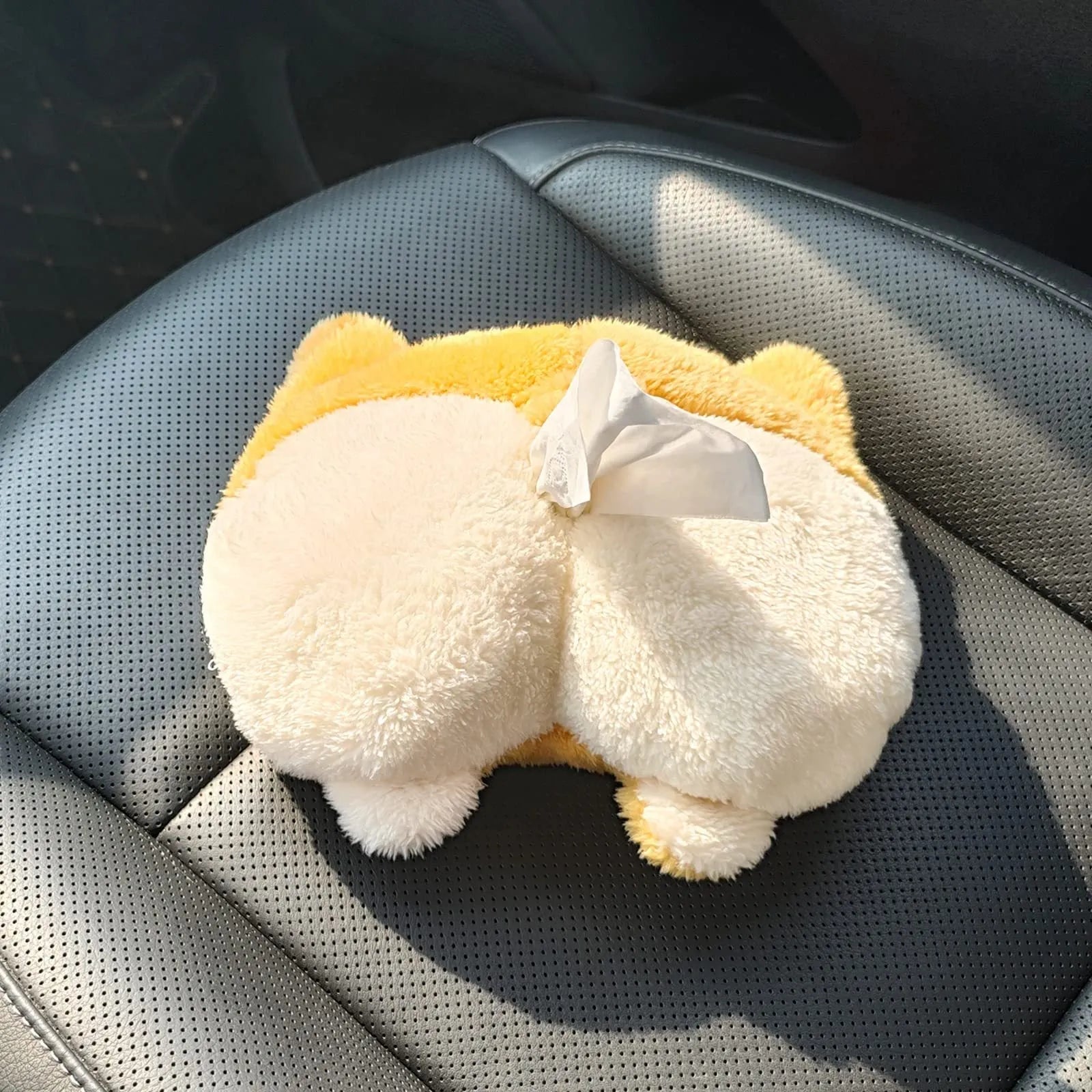 Yellow soft plush corgi butt shaped tissue box cover with elastic straps for car visor.