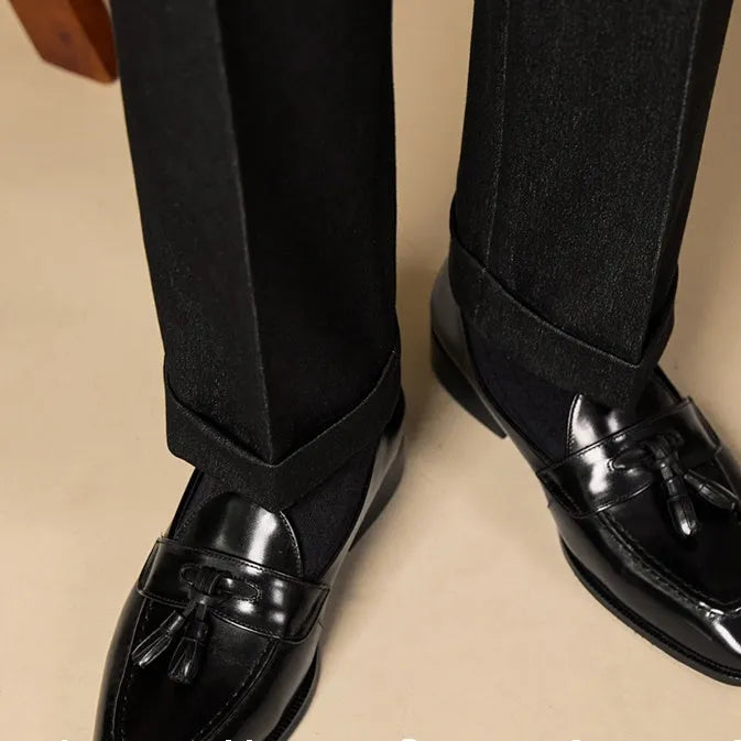 Men's polished leather tassel loafers in black and coffee colours with traditional British styling
