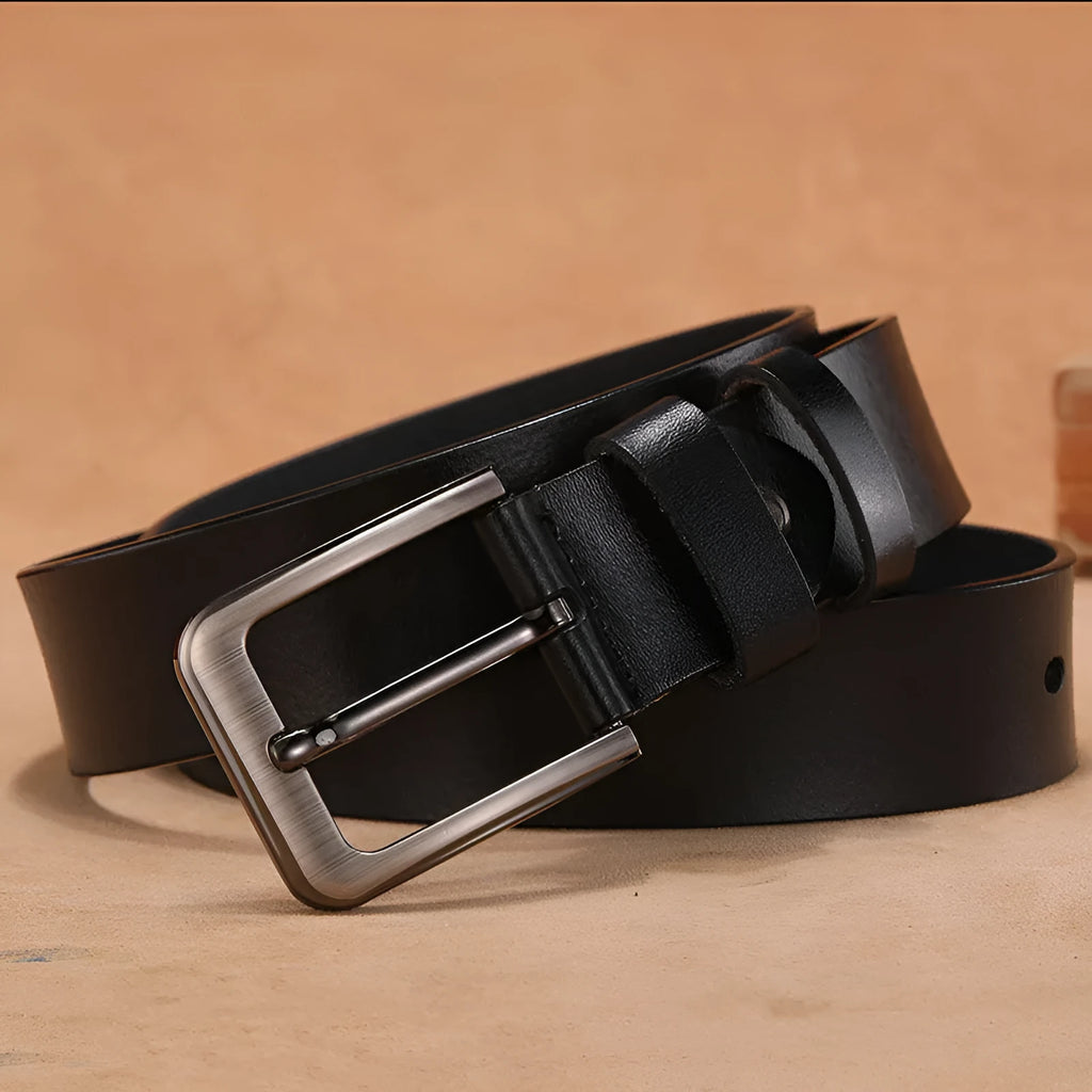 Men's black casual belt with a square silver alloy pin buckle, laid flat to show length.