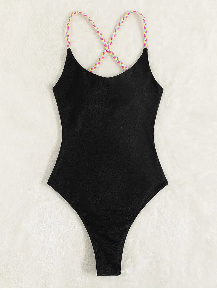 Black solid colour backless one-piece swimsuit on mannequin showing sleeveless design