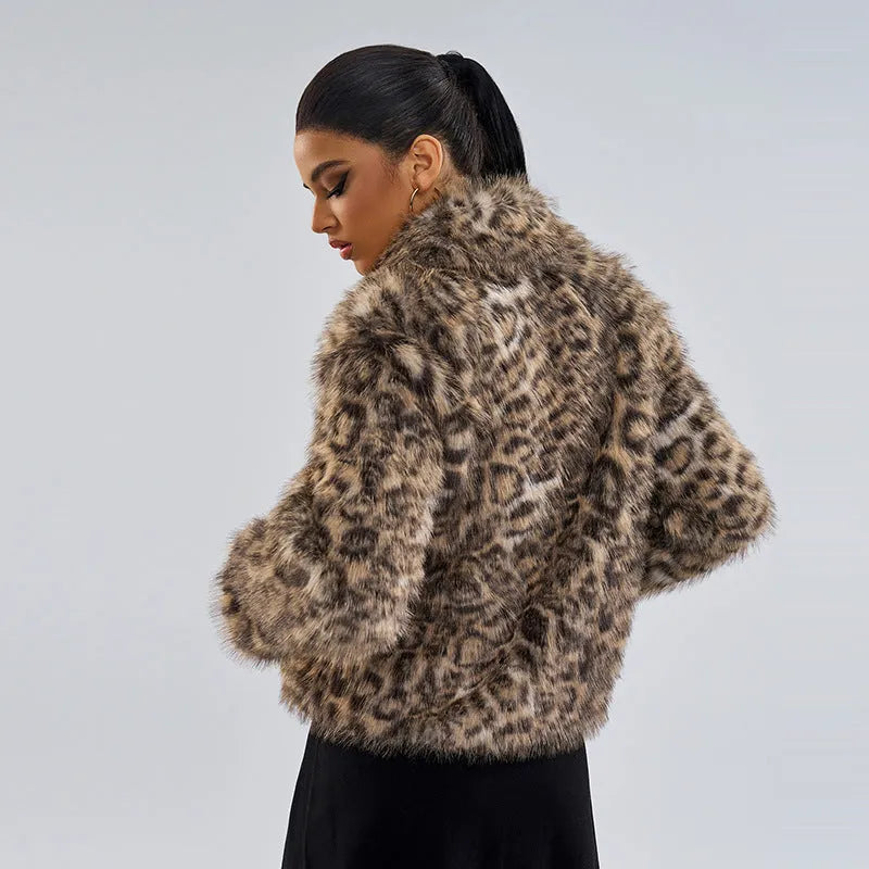 Female leopard print coat with a silver buckle detail on the lapel.