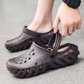 Men's beige EVA slipper sandals showing hollow-out design and non-slip sole pattern.