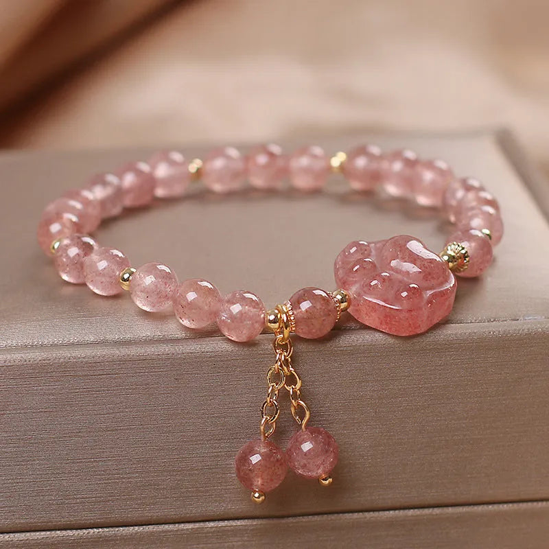 Women's double layer strawberry quartz bracelet with lucky cat charm in red cat's eye flowers colour.