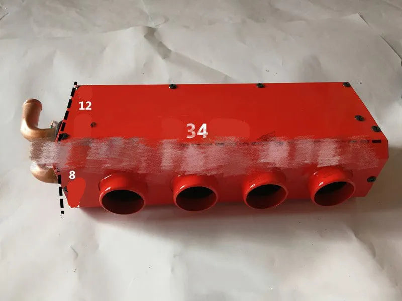 Small metal car heater core unit with copper pipes and electrical connections for 12V 24V installation.