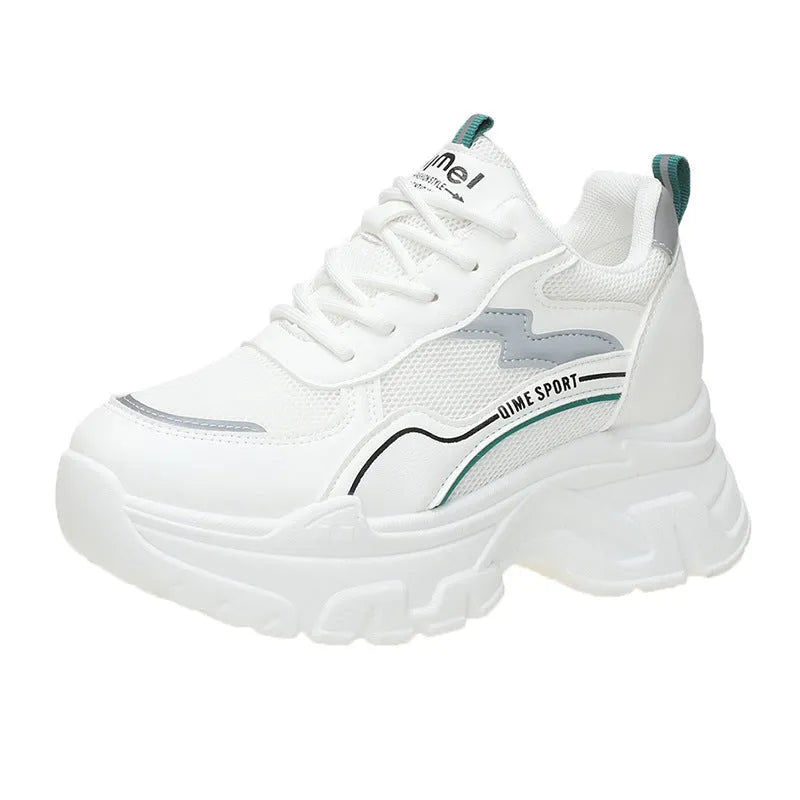 Women's white height increasing dad shoes with cross straps and lace-up front on rubber sole.