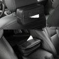Black PU leather hanging storage box for car console organisation, shown with paper bag filler.