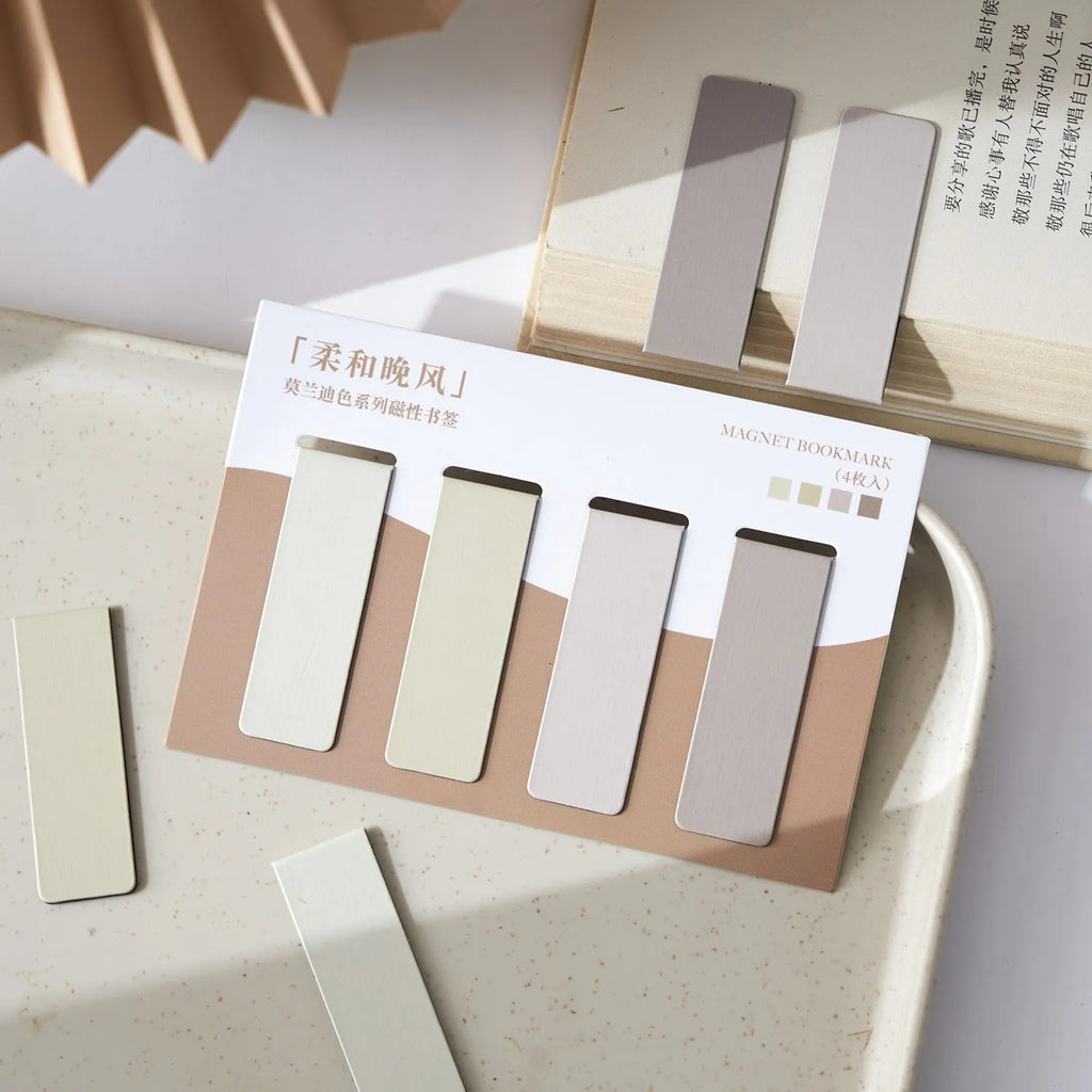 Set of four miniature magnetic bookmarks in Morandi colour block designs: soft blue, grey-green, dusty pink, and mauve.